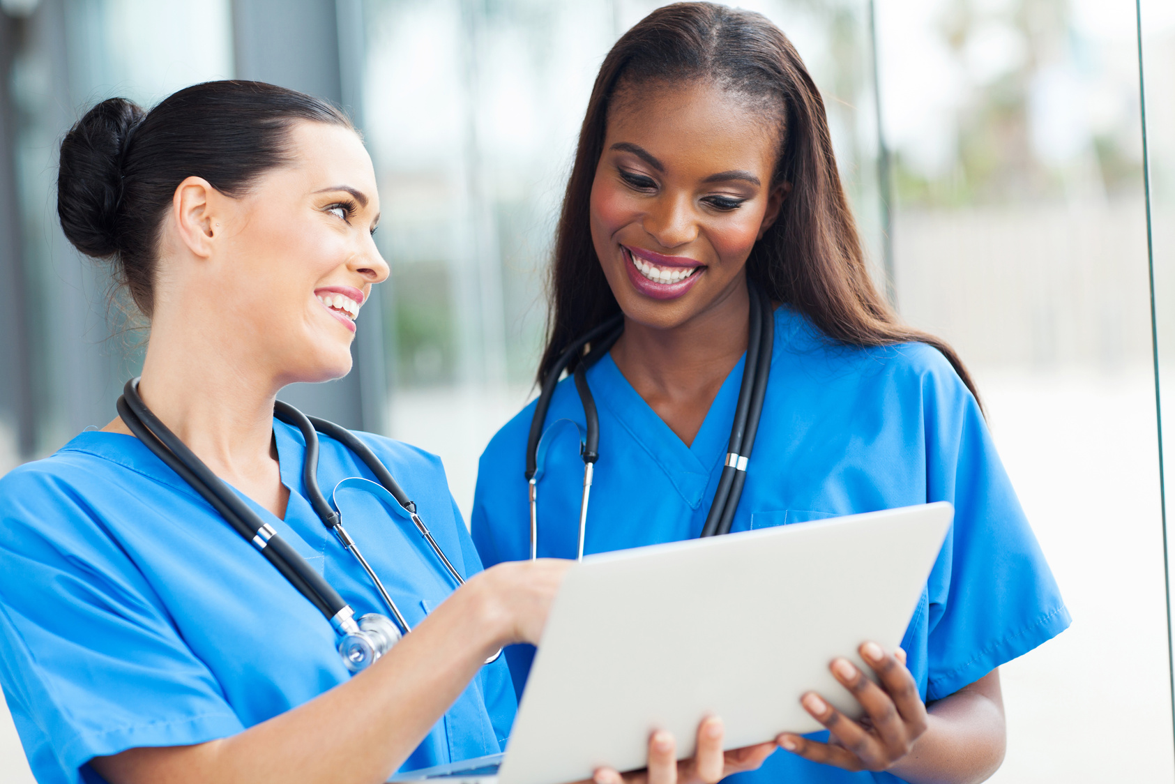 two nurses using laptop computer